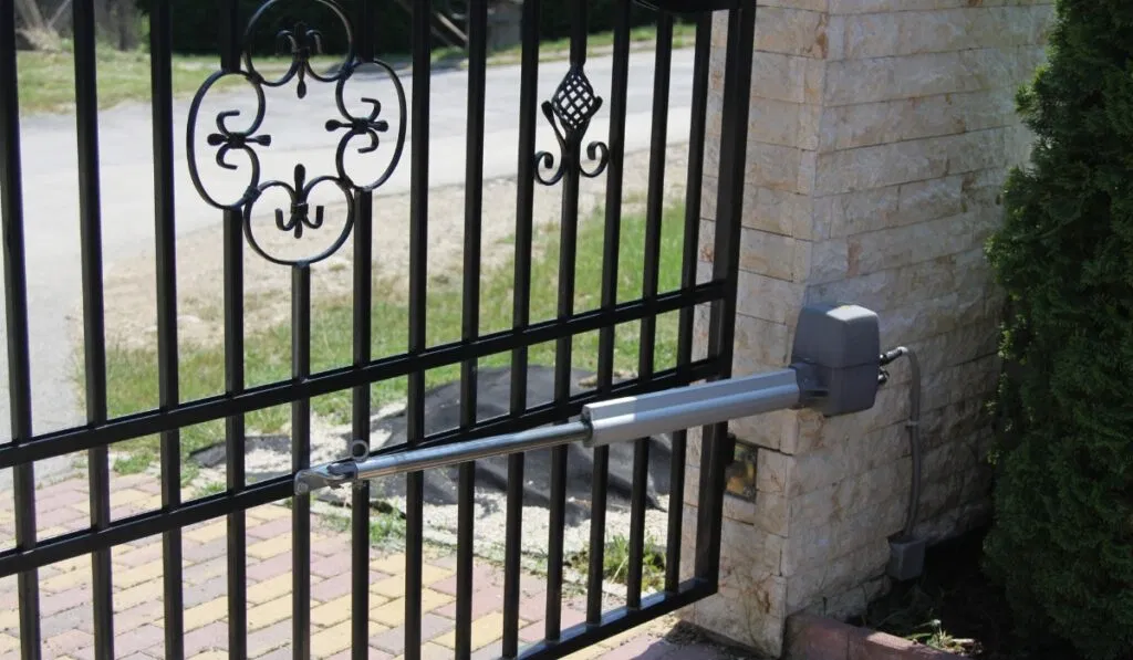 Person pressing remote but gate not opening