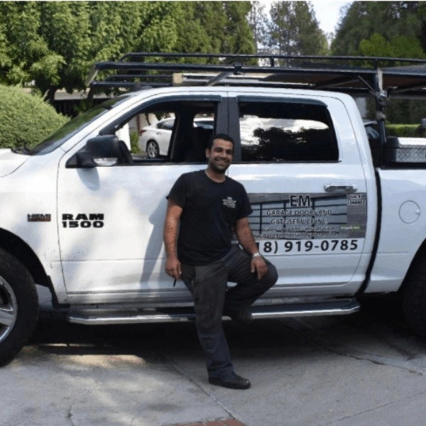 Technician fixing automatic garage and gate system in LA