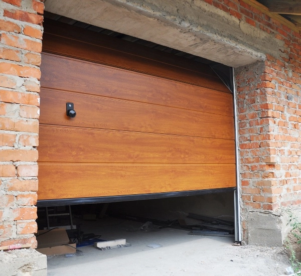 Lubricating garage door tracks